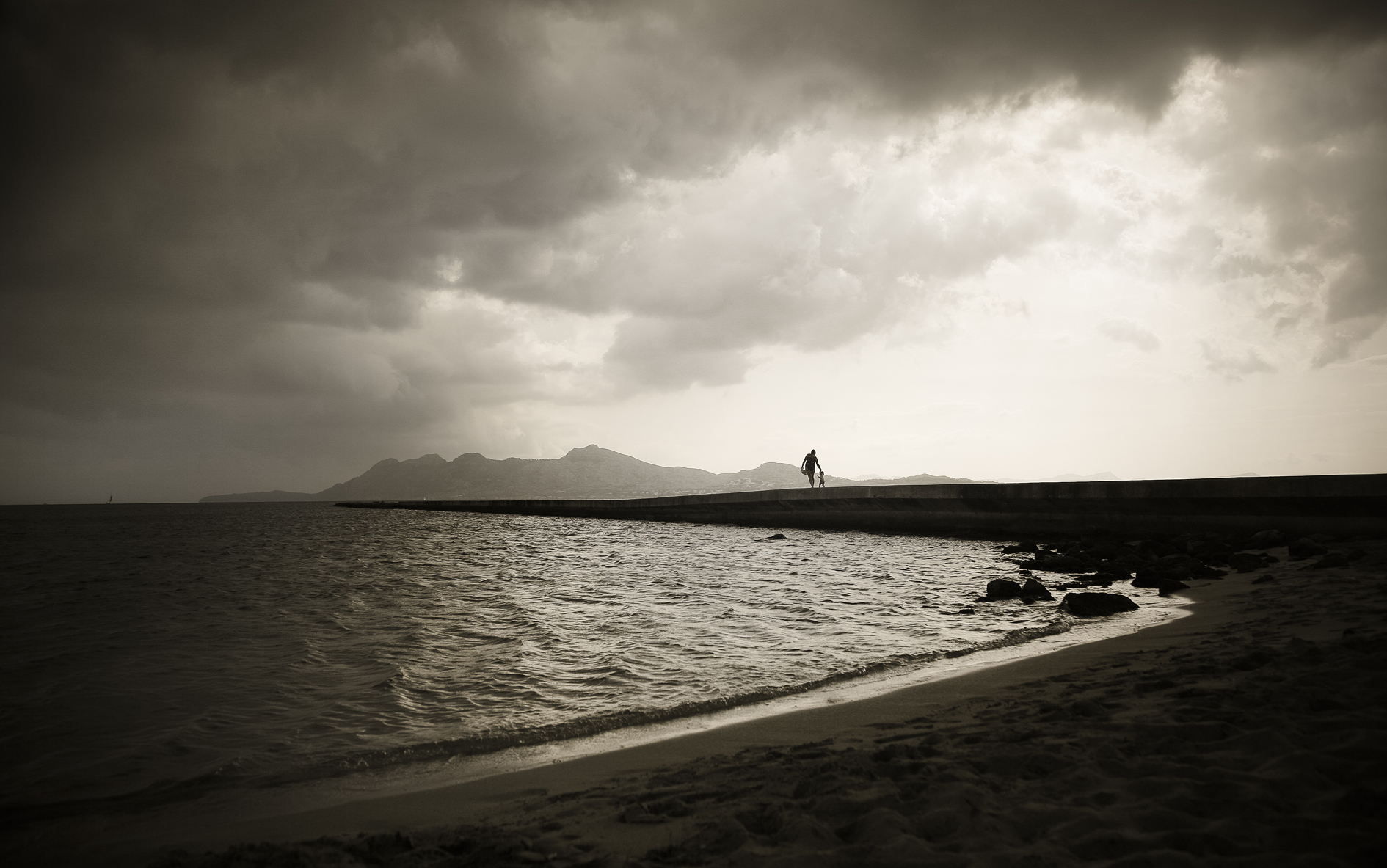 photography, photograph, art, fine art, Sepia, Black and white, B&W, Mallorca, beach, walking, mother and child, breakwater, storm, clouds, moody
